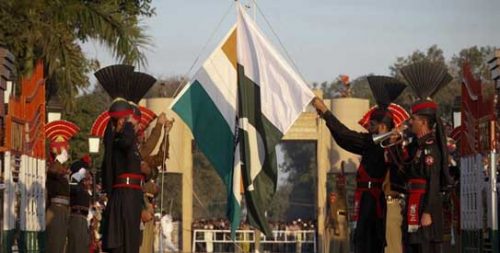 Pakistan Rangers and Indian Border Security Force personnel take part in daily flag lowering ceremony at their joint border post of Wagah near Lahore